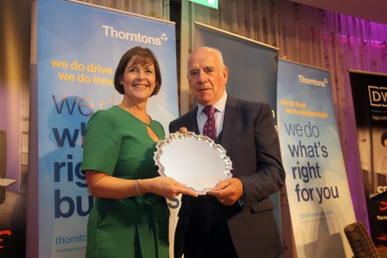 To go with story by Laura Devlin. Dundee Sports Dinner  Picture shows; Denis McGurk being honoured with the Lifetime Achievement Award. Invercarse Hotel . Supplied by Dundee Sports Dinner  Date; 18/09/2024