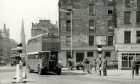 Dundee's new Overgate Centre is yet to be built as a former London bus heads through the city centre for Fintry.