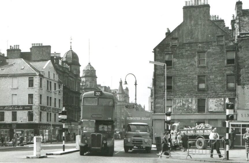 This former London bus is heading past the Overgate to Fintry.