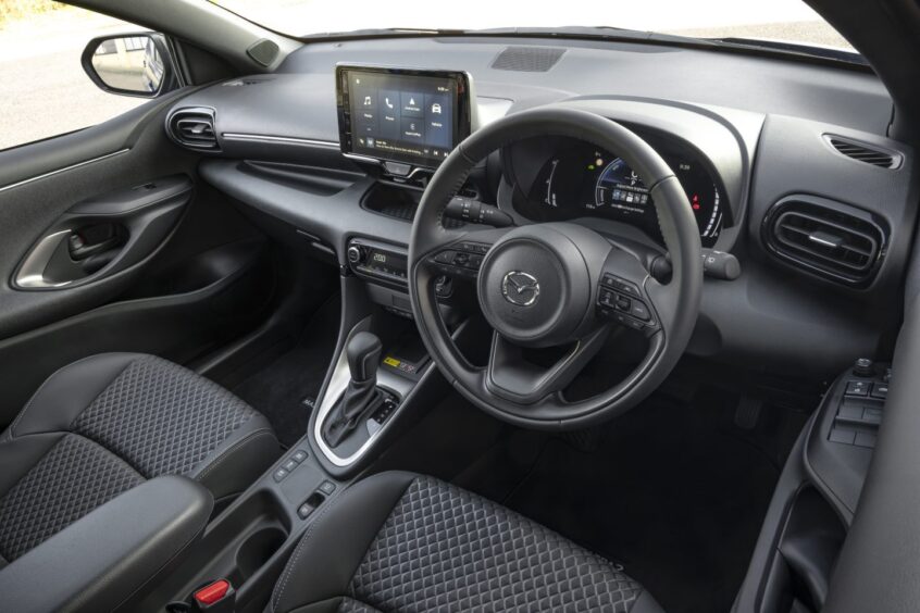 The front interior of the Mazda 2 Hybrid. 