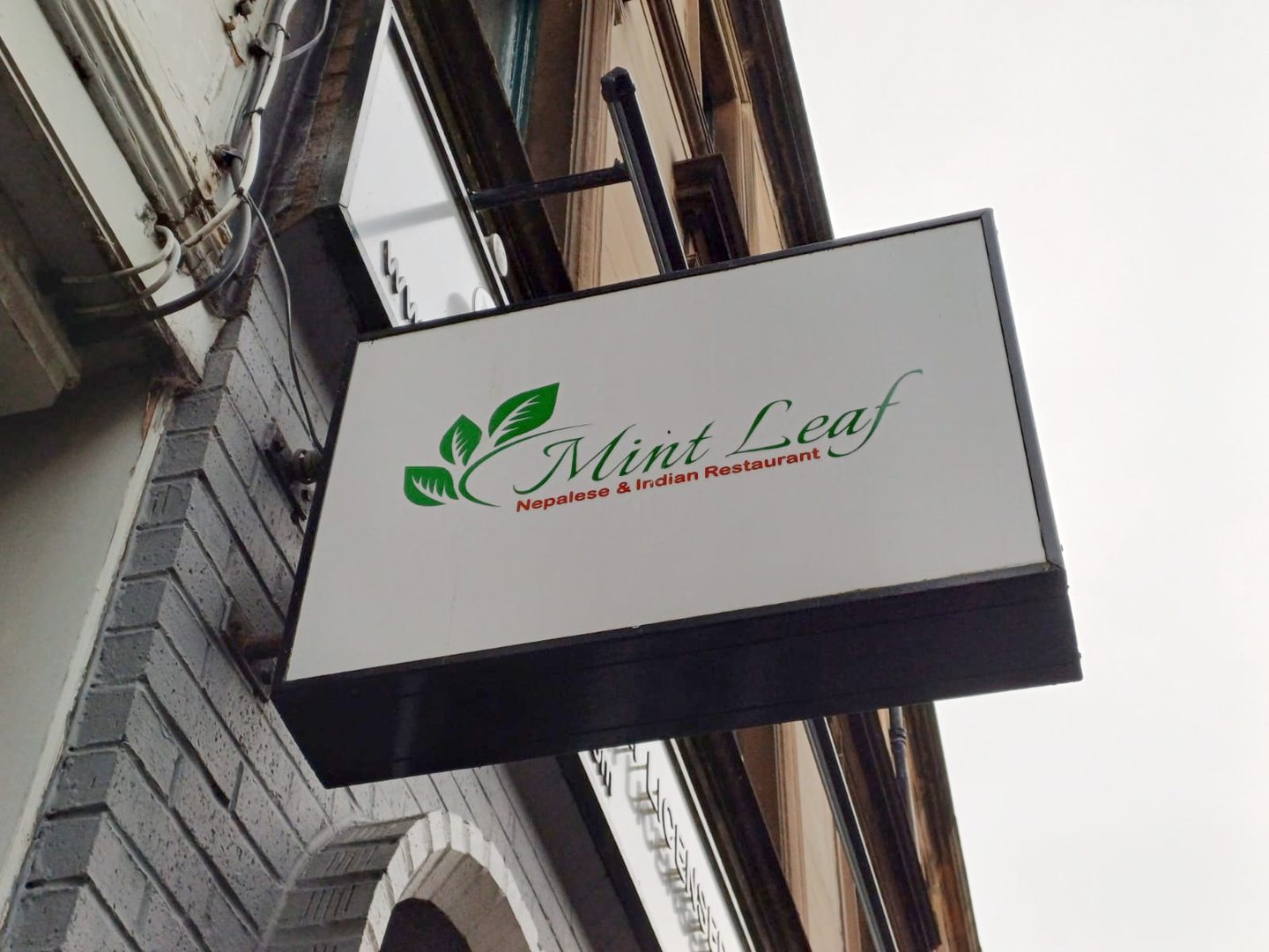 Close-up of box sign for Stirling Indian and Nepalese restaurant, Mint Leaf