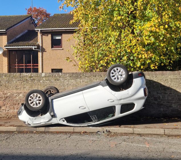 The overturned car in Monifieth