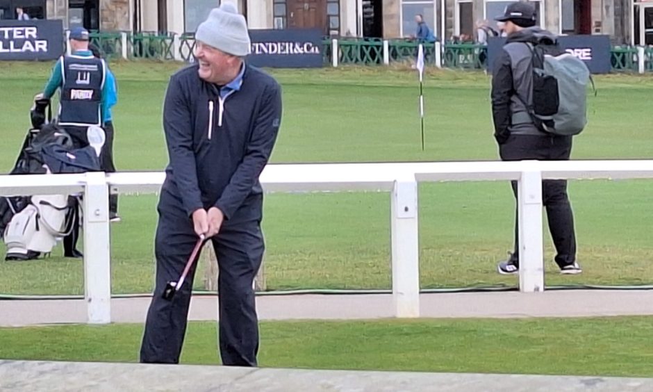 Piers Morgan on the practice green at St Andrews