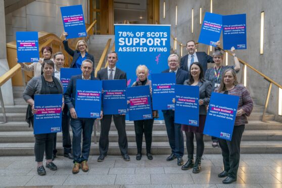 Scottish Liberal Democrat MSP Liam McArthur (centre, left), alongside other MSPs, during a media event at the Scottish Parliament in Edinburgh, after publishing his Assisted Dying for Terminally Ill Adults (Scotland) Bill. If passed, the bill will allow people living in Scotland with a terminal illness to be given help to end their life. Picture date: Thursday March 28, 2024. PA Photo. See PA story POLITICS AssistedDying. Photo credit should read: Jane Barlow/PA Wire