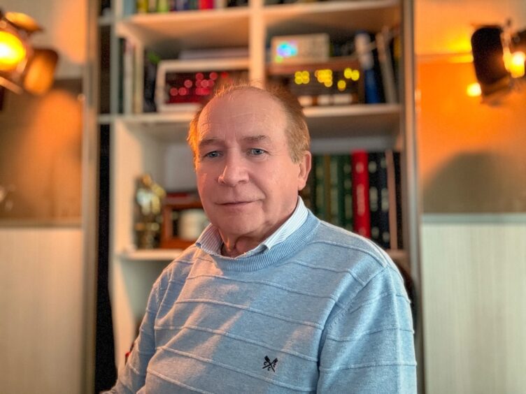 Professor Peter Myers of Liverpool University sitting in his study.