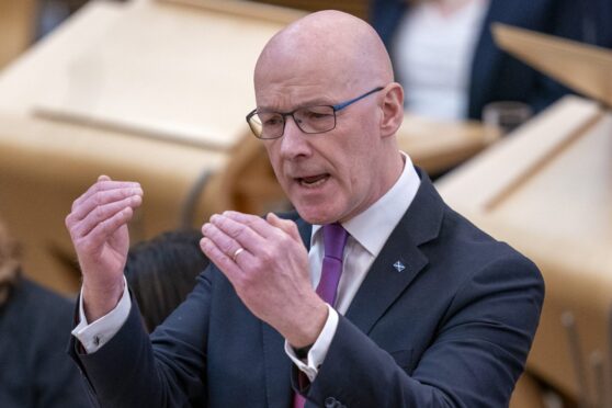 First Minister of Scotland John Swinney during First Minister's Questions at the Scottish Parliament in Holyrood, Edinburgh. Picture date: Thursday October 10, 2024. PA Photo. See PA story SCOTLAND Questions. Photo credit should read: Jane Barlow/PA Wire