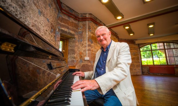 CR0049170 - Rebecca Baird Story - Angus area - Alan Steadman, voice of the Speaking Clock, as he celebrates 35 years of jazz at Hospitalfield with a lookback in the room where every single one of the concerts has taken place - Picture shows Alan Steadman - Hospitalfield House, Hospitalfield, Arbroath -- Friday 19th July 2024 
Image: Steve MacDougall/DC Thomson