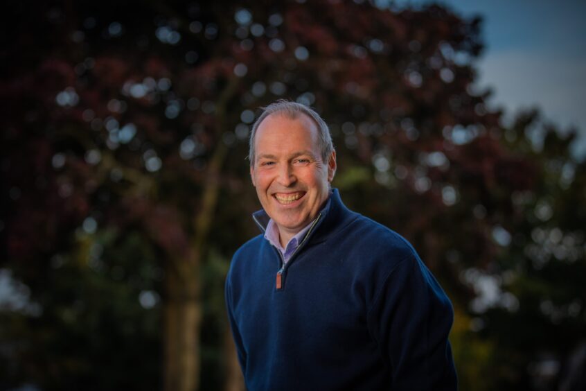 Smiling hypnotherapist Stewart McDonald outside his home in Dundee. 