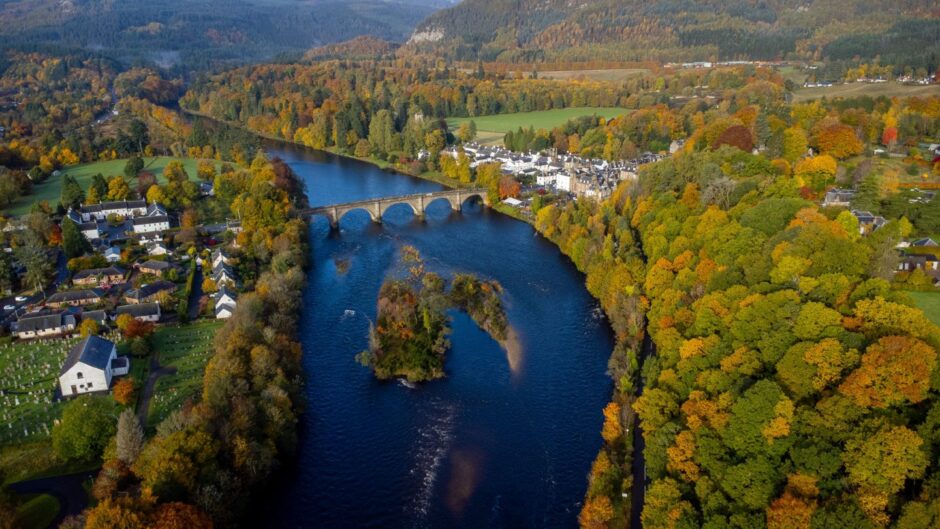 An aerial image showing the autumn trees along the River Tay near Dunkeld