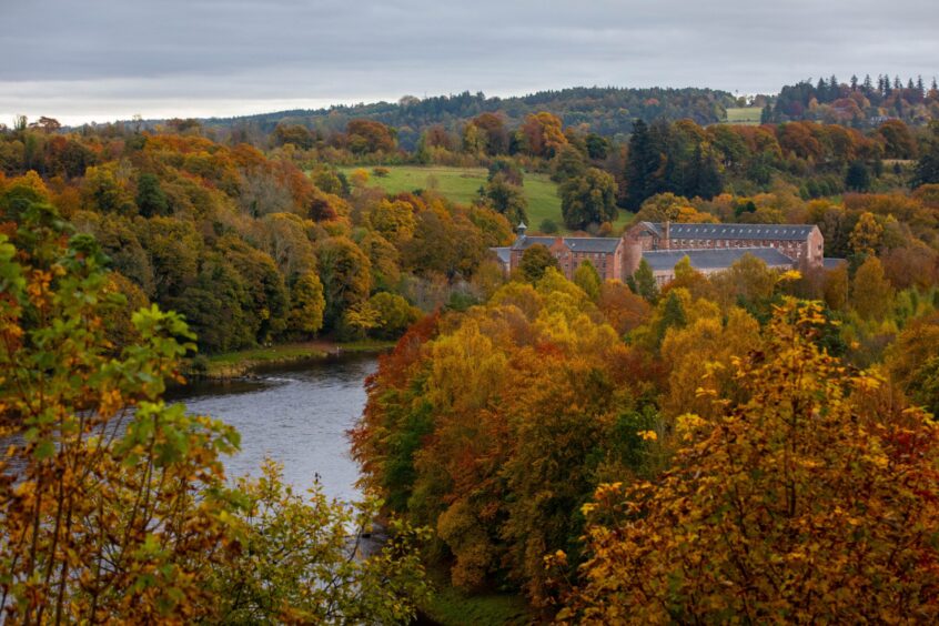 Autumn has fallen across Perthshire with Stanley Mills nestled within the golden foliage.