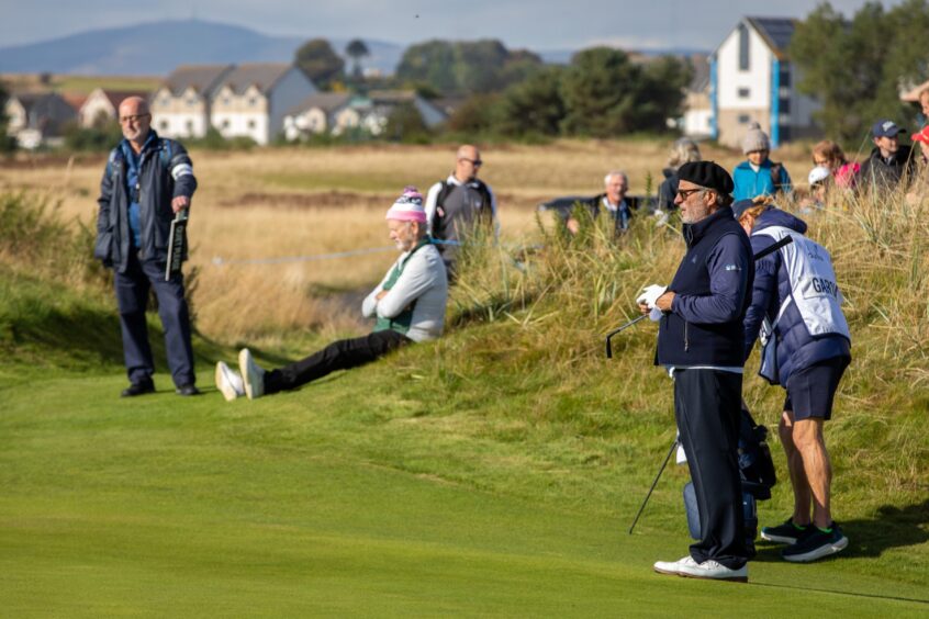 Bill Murray has a seat while Andy Garcia contemplates his next shot in this year's Alfred Dunhill Links Championship