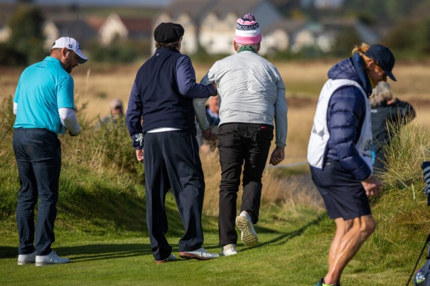 Andy Garcia helps Bill Murray at the Dunhill Cup in Carnoustie, Tayside