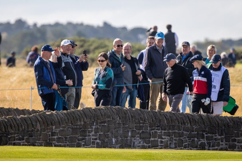 Fans get pictures  of Kathryn Newton and Michael Douglas as they walk past at the Alfred Dunhill Links Championship in Carnoustie