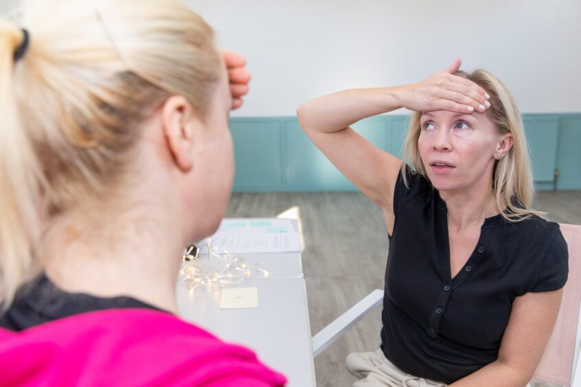 Debbie follows Natalie with some eye exercises. 