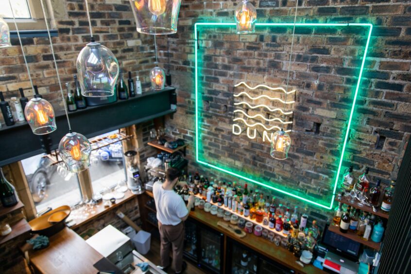 The view form upstairs in Dune down to the colourful bar below.