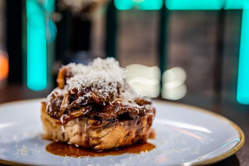 Dune's wild mushrooms and toast covered in parmesan shavings.