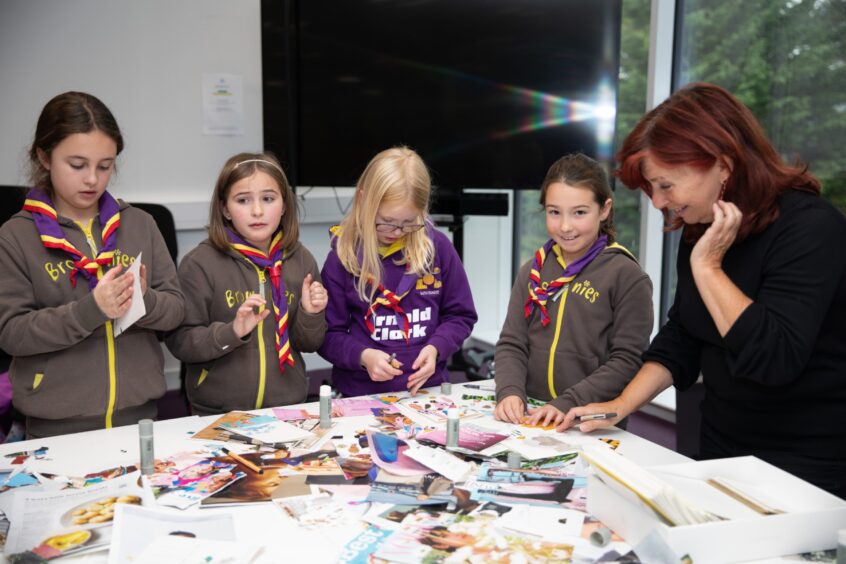 Brownies from 64th Broughty Ferry take part in Scrapbooking with Linda B Draws Dundee.