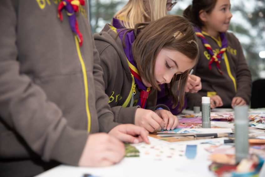 A Brownie does scrapbooking with Linda B Draws Dundee.