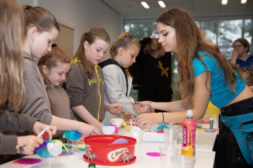 Brownies from 29th Stobbswell, 30B Barnhill and 31st A Perth Road from Dundee take part in Scrap Antics during Girlguiding Dundee Adventure on your Doorstep event at Caird park. 