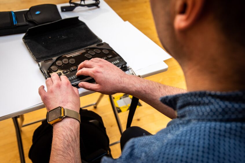 Blind man Stuart Beveridge uses a Braille Sense 6 to allow him to take notes, write emails and navigate the internet.