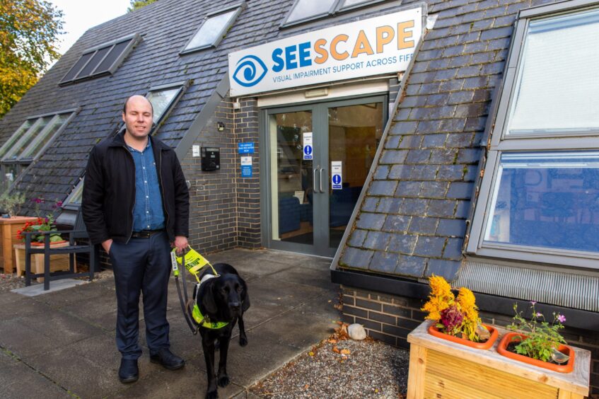 Stuart Beveridge with Guide Dog Dax, 3, at Seescape in Glenrothes.