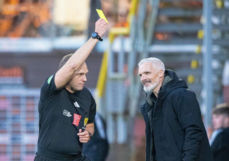 Jim Goodwin picks up a booking following his dash onto the pitch