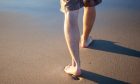 Stock pic of feet on beach.