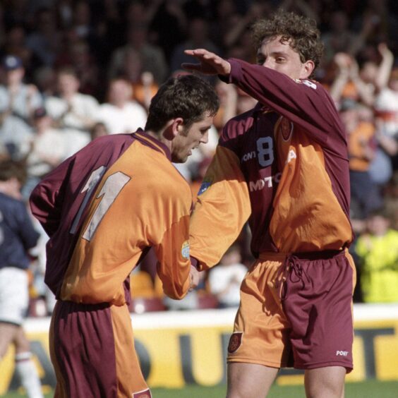 Simo Valakari congratulates Owen Coyle after the striker scored for Motherwell. 