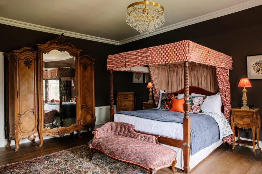 a four-poster bed in one of the bedrooms