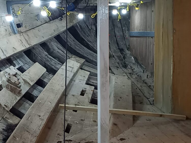 Contrast between old and new timbers within bowels of RRS Discovery. 