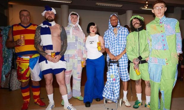 Robyn with the GADGIE models at London Fashion week, including grandad Eric (far left) and uncle Steven (second from left). Image: Phillip Banks/Jason Lloyd Evans/GADGIE