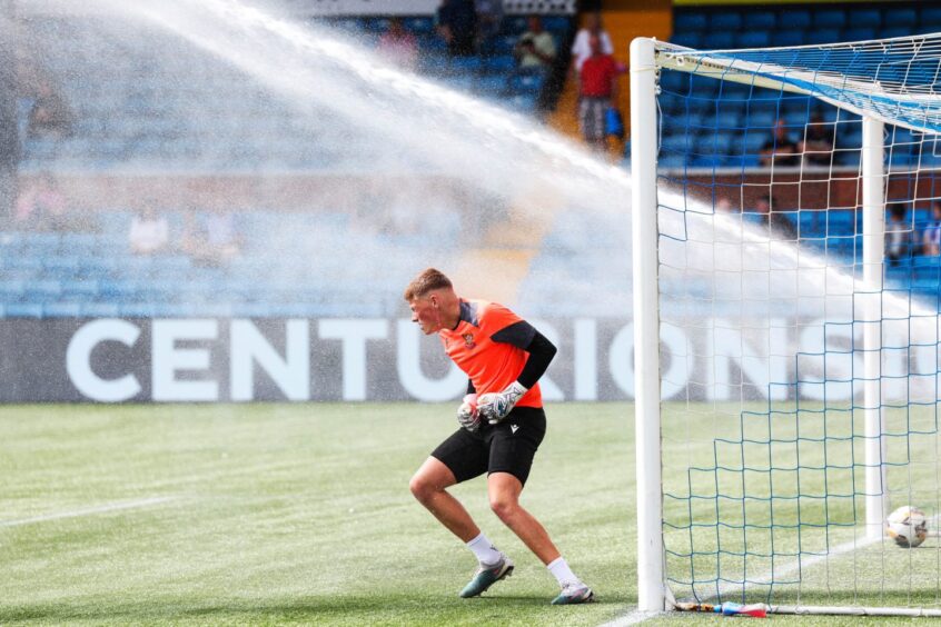 Craig Hepburn tries to dodge the Kilmarnock sprinklers.