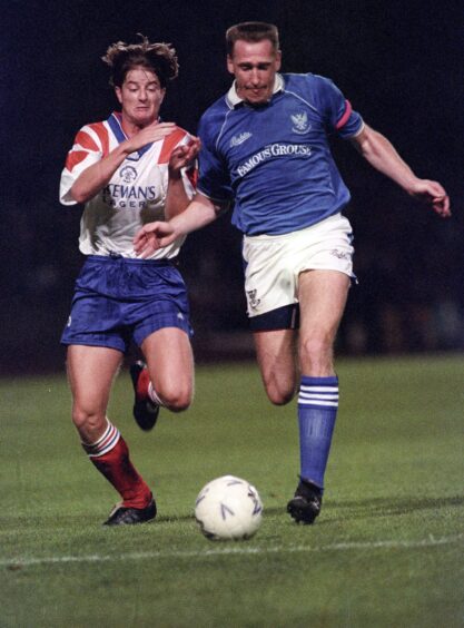 John McClelland battles for the ball with Rangers winger, Pieter Huistra, in the 1992 Skol Cup semi-final at Hampden Park. 