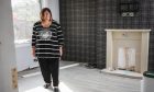 June Soutar in her home on East Mill Road in Brechin, which is still in the process of being refurbished a year on from Storm Babet. Image: Mhairi Edwards/DC Thomson.