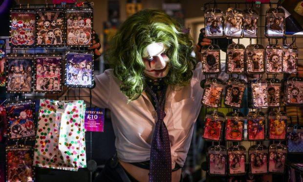 Digital artist Clownetina dresses as the joker at her market stall in Dundee.