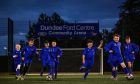 Dundee West 2014 Yellows enjoying the new pitch. Image: Mhairi Edwards/DC Thomson.