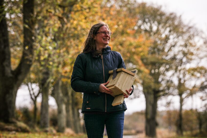 Perth and Kinross Bat Group volunteer Emilie Wadsworth with one of her bat boxes in the grounds of Kellie Castle in Fife. Image: Mhairi Edwards/DC Thomson.