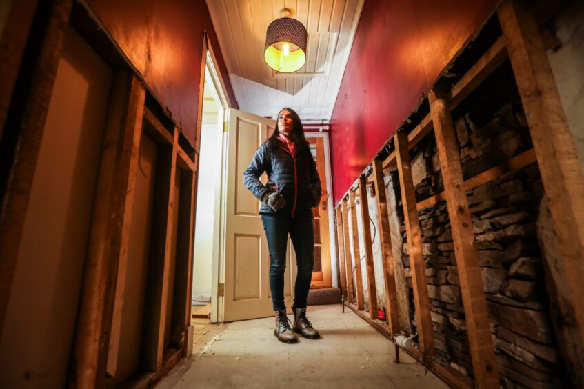 Gayle inside her home in Kinnettles, a year on from Storm Babet. Image: Mhairi Edwards/DC Thomson.