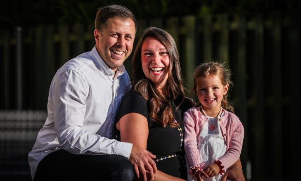 Fife mum Erin was diagnosed with breast cancer at the age of 26. She is pictured with husband Aaron and daughter Sophia.