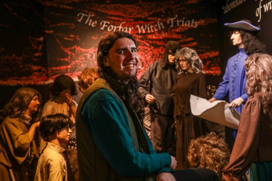 CR0050139, Rebecca Baird, Forfar, Shaun Wilson is a visitor assistant at Meffan Museum this Witch Week. He is autistic and we're going to be chatting about the link between witches and neurodivergent people for a mag cover feature. Picture shows; Visitor Assistant Shaun Wilson in amongst the Forfar witch trial display. Friday 27th September, 2024.  Image: Mhairi Edwards/DC Thomson