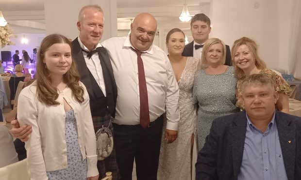 Michael Alexander (second left) with members of his Scottish family and members of the Polish Kulesa family, including bride, groom and bride's parents, at the September 2024 wedding reception in Poland. Image: Michael Alexander