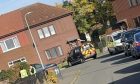 Police and SSPCA officers remove dead puppies from home in Linlathen, Dundee.