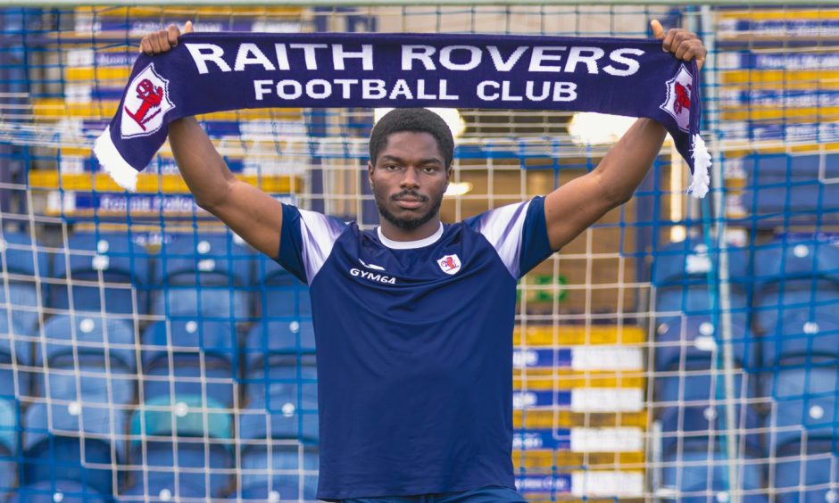 New signing Cody David holds up a Raith Rovers scarf.