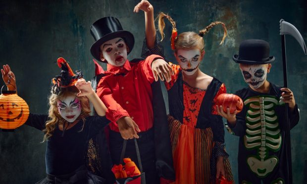 Group of children, little boys and girls in stylish costumes for halloween and creepy makeup over dark vintage background. Concept of Halloween, childhood, celebration, party, holiday, creativity, ad; Shutterstock ID 2351910593; purchase_order: ; job: