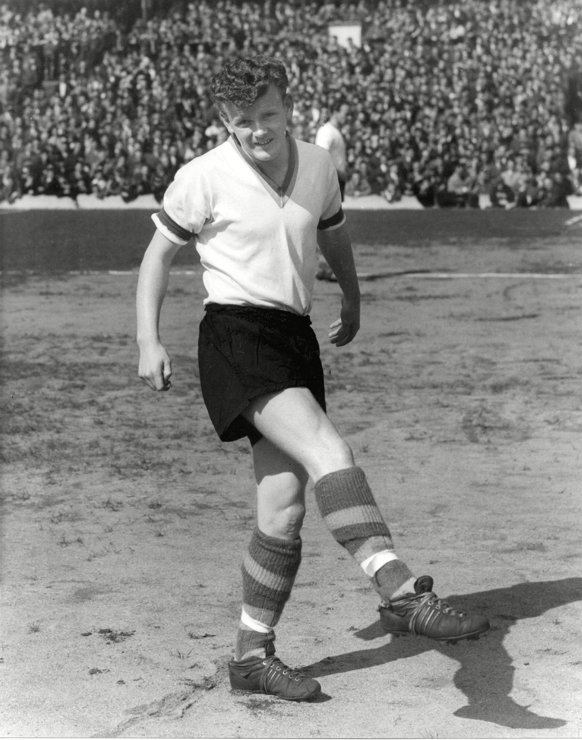 Billy Bremner poses for a picture on the pitch in 1960, aged 17, while with Leeds.