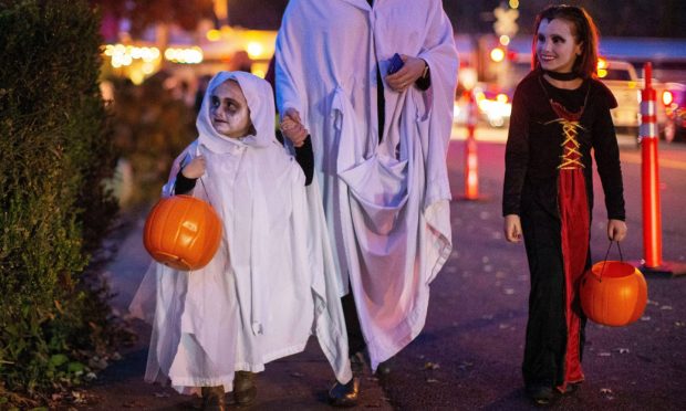 Children in costume trick or treating. Image: ERIK S LESSER/EPA-EFE/Shutterstock