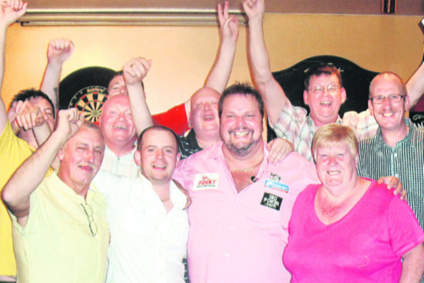 Pub manager Cathy Colligan and regulars with Peter Manley. 