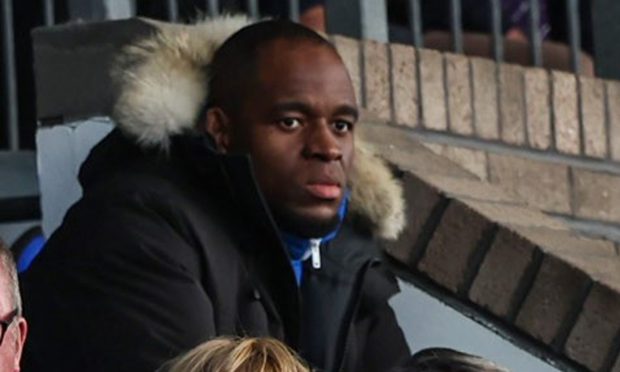 St Johnstone striker Uche Ikpeazu sits in the stands