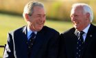 Professor Wilson Sibbett (right) with former US President George W Bush at the 2013 Walker Cup. Image: Sibbett family