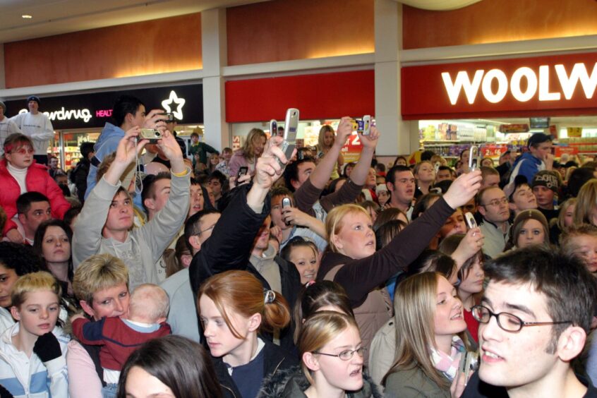 Some of the fans taking photographs of the members of Girls Aloud in Kirkcaldy in 2005. 